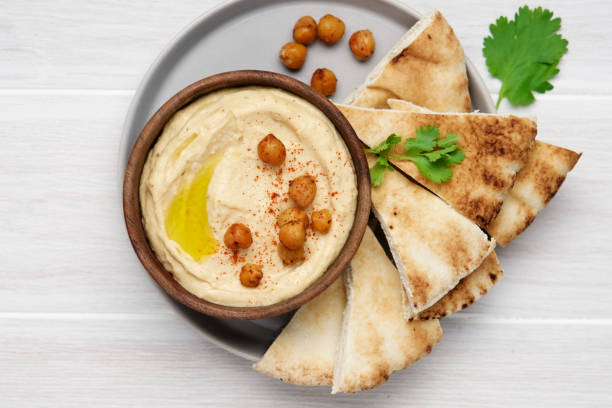 Hummus plate with pita bread. Authentic arab cuisine stock photo