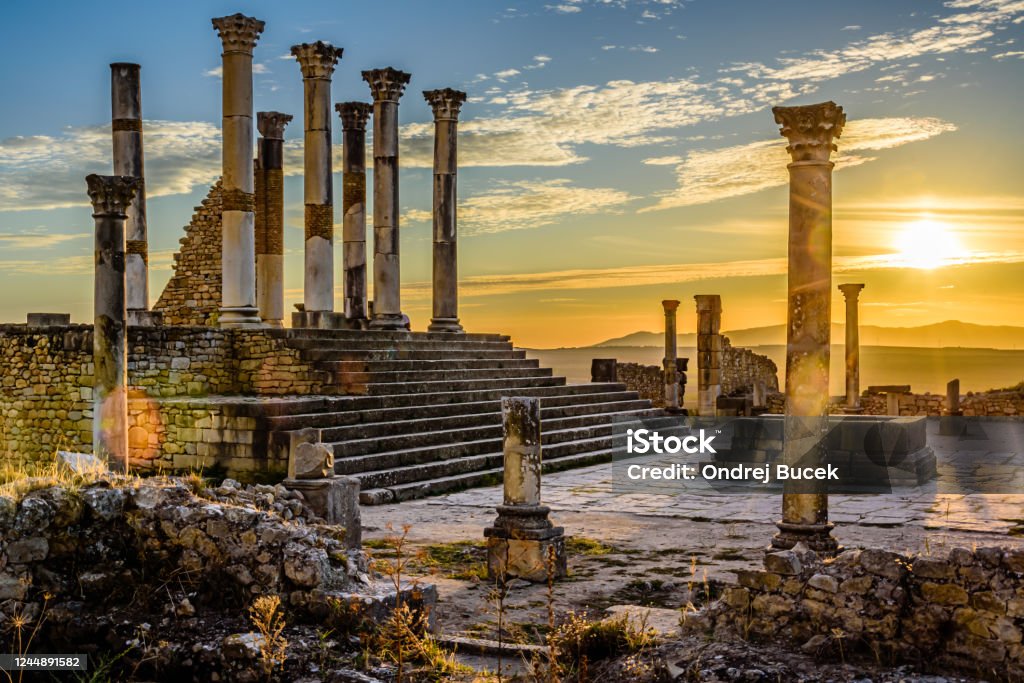Ancient city of Volubilis Volubilis is a partly excavated Berber city in Morocco situated near the city of Meknes, and commonly considered as the ancient capital of the kingdom of Mauretania. Morocco Stock Photo