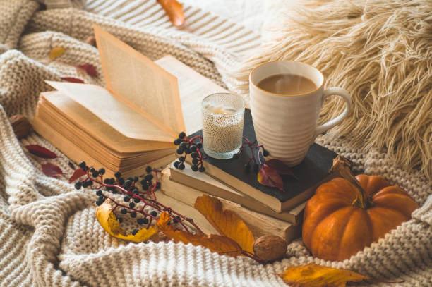 istock Still life details in home interior. Autumn decor. Read, drink coffee, Rest. 1244895646