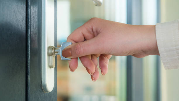 istock Woman opens the front door with the key 1244901505