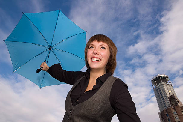 istock Smiling woman with umbrella 124490188