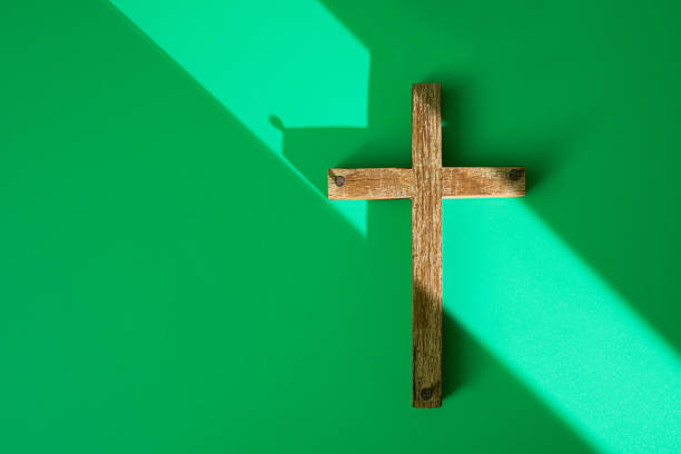 istock Woodne cross with nails on green background 1244914253