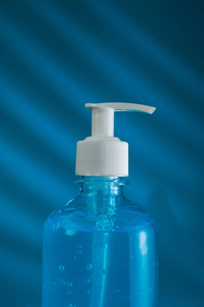 istock alcohol hand gel on blue background 1244915434