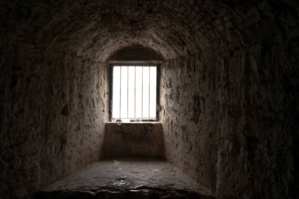 Dungeon window Dungeon window, dark and old the light shine through the window dungeon medieval prison prison cell stock pictures, royalty-free photos & images