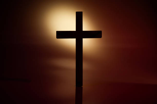 istock Wooden cross photograph with harsh lighting 1244917765