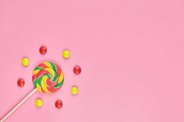 istock Sweet lollipop and candy on pink background 1244921633