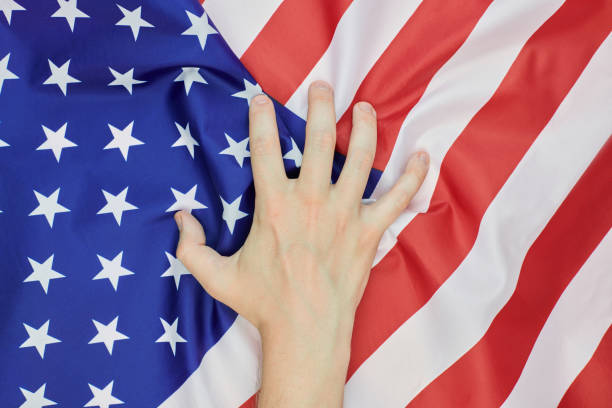 istock Hand crumpled national USA american flag 1244921649