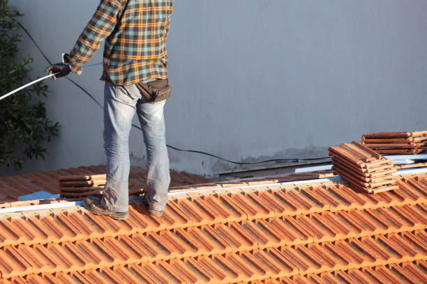 istock Construction Worker Tile Roofing Repair sunny day 1244927931