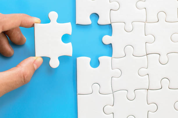 istock Hand connect jigsaw parts with word problem & solution.   symbol of association and connection. business strategy. Teamwork concept. 1244931879