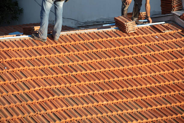 istock Construction Worker Tile Roofing Repair sunny day 1244932100