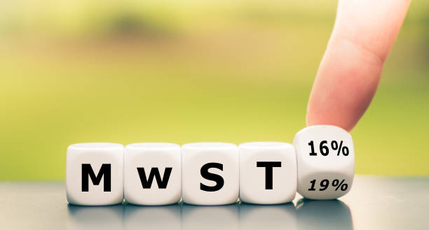istock German stimulus packages after the corona crisis. Hand turns dice and changes the expression 