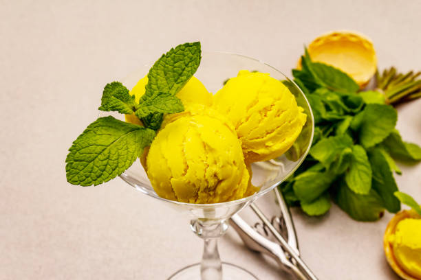istock Lemon ice cream with mint. Refreshing summer dessert, ripe fruit, fragrant leaves 1244935001