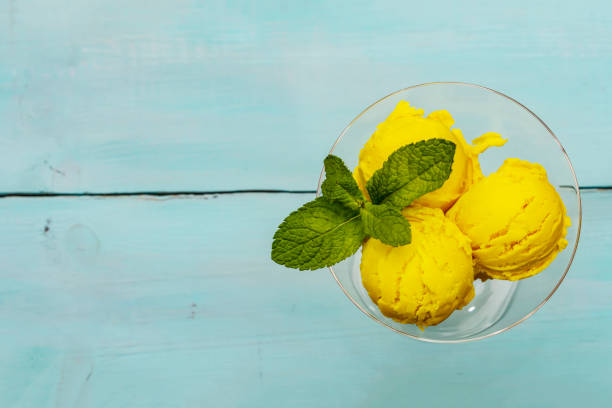 istock Lemon ice cream with mint. Refreshing summer dessert, ripe fruit, fragrant leaves 1244935209