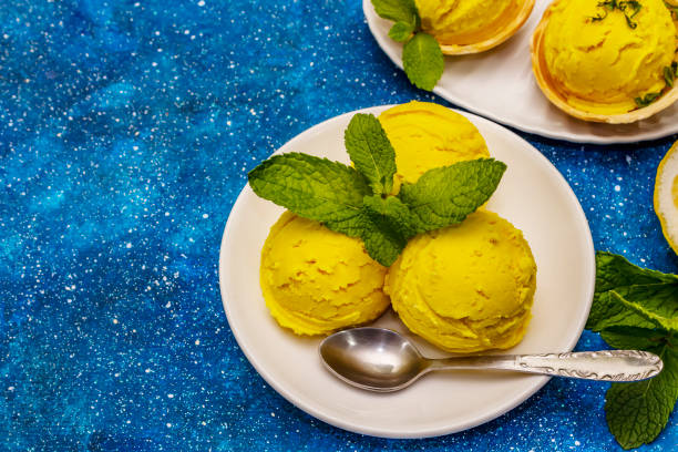 istock Lemon ice cream with mint. Refreshing summer dessert, ripe fruit, fragrant leaves 1244935964