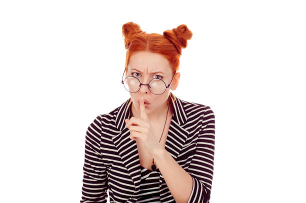 istock Patronizing woman with finger on lips asking shh, quiet 1244936808