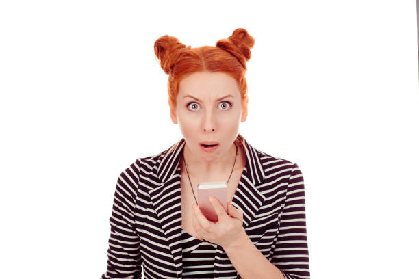 istock shocked woman in her 30s looking at cellphone stunned 1244936832