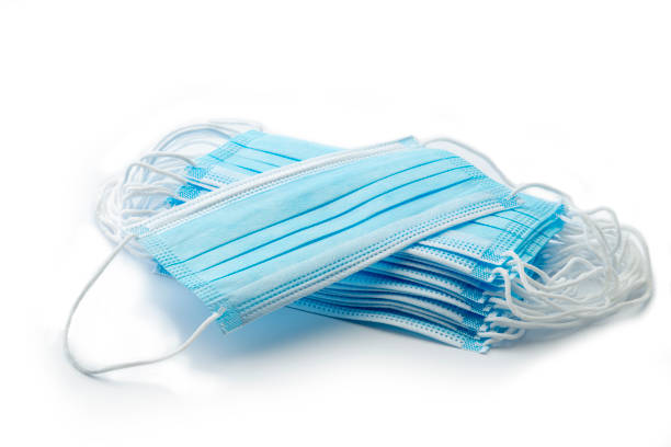 Blue medical masks on white background