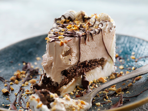 Cookie Dough Ice Cream Cake with Chocolate Sauce and Crushed Almonds