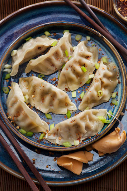 istock Steamed Dumplings with Soy Sauce and Green Onions 1244937188