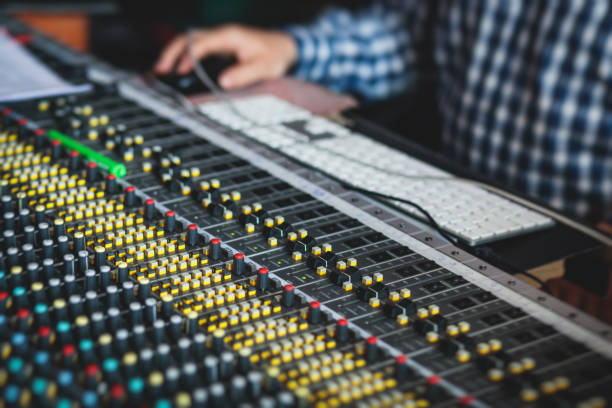 istock Sound editor engineer working at studio with mixing panel, mixing music and sound, stage sound mixer, boutique recording studio, working during concert performance recording, broadcasting studio 1244942799