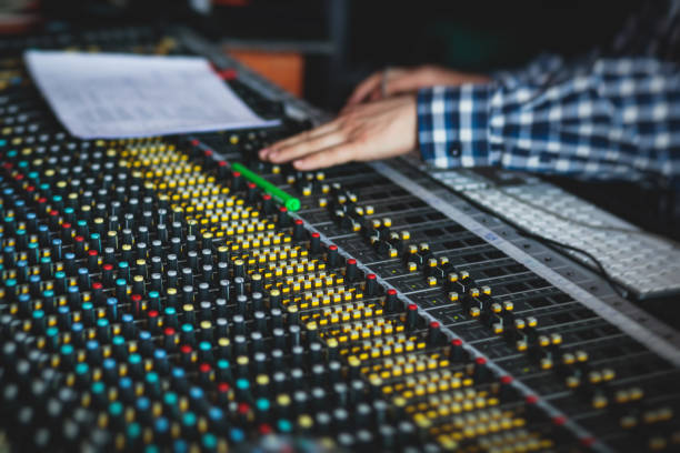 istock Sound editor engineer working at studio with mixing panel, mixing music and sound, stage sound mixer, boutique recording studio, working during concert performance recording, broadcasting studio 1244942812