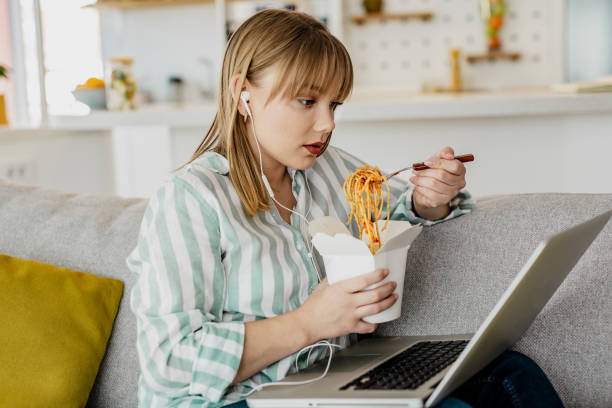 istock Enjoying at home eating takeaway meal 1244955909