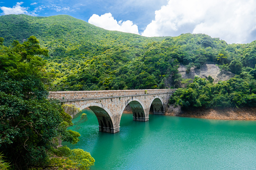 Tai Tam reservoir main dam, located in the Tai Tam Country Park in the eastern part of Hong Kong Island.