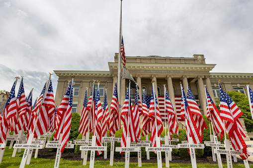 Morristown, Tennessee, USA - May 22, 2020:  Memorial Day celebrated with flags and crosses with names of those who served.