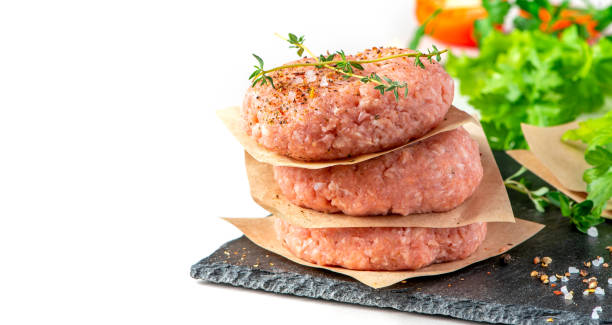 istock A stack of raw pork cutlets close-up 1244963195