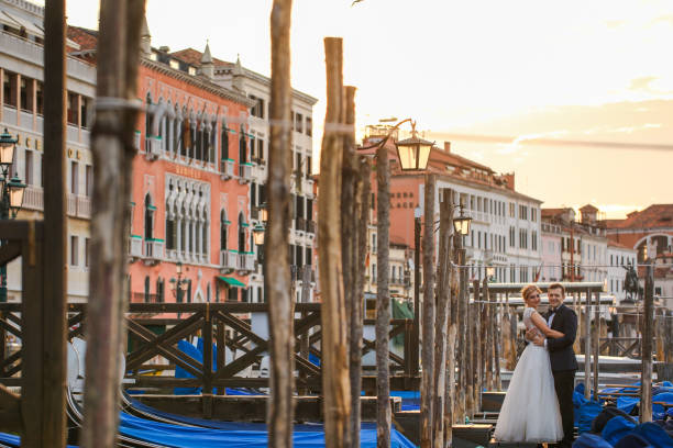 istock beautiful wedding couple posing near dock 1244969862