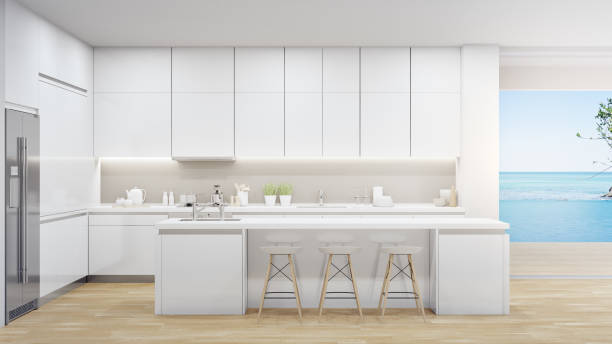 istock Island of modern kitchen in luxury beach house. 1244973225