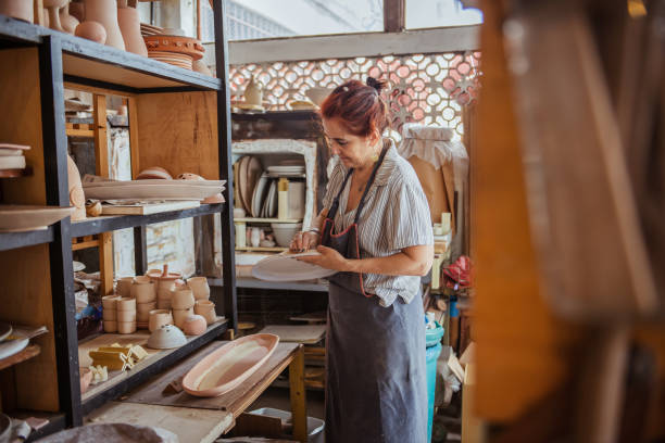 istock Senior woman in ceramics workshop. 1244976563