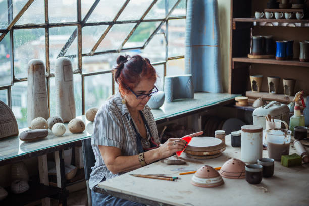 istock Senior woman in ceramics workshop. 1244978860