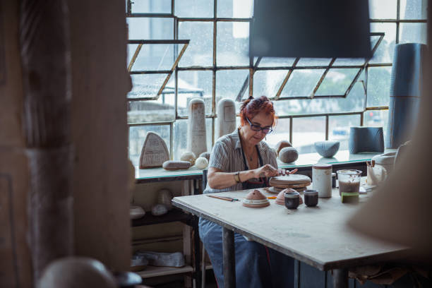 istock Senior woman in ceramics workshop. 1244979262