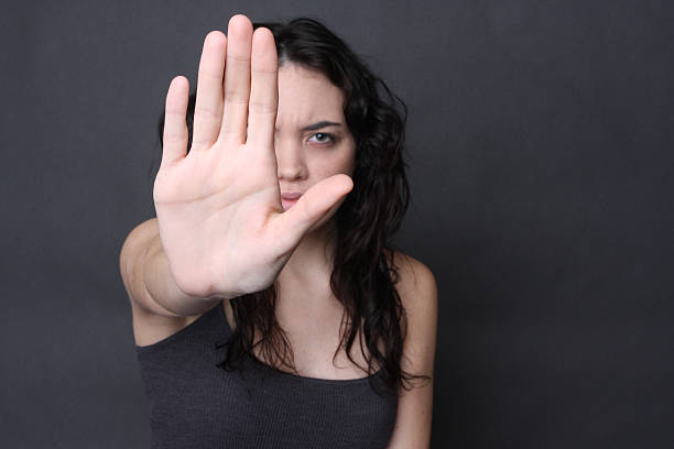 self defense angry girl holds up her hand to stop pretator and end the cycle of abuse self defense stock pictures, royalty-free photos & images