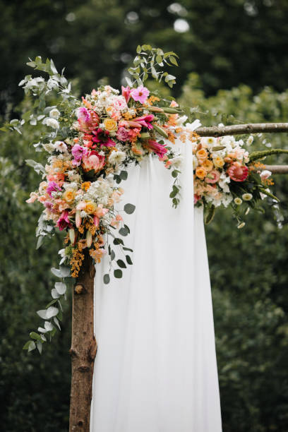 istock Decorated luxury wedding ceremony arch in the garden. 1245000533