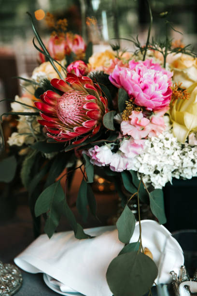 istock Beautiful, decorated table with flower decorations.  Wedding or party decorations. 1245002181