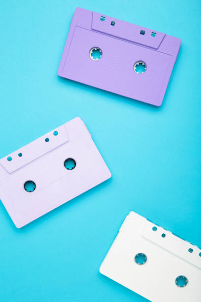 istock Old colorful cassettes on a blue background. Music day 1245007072
