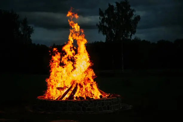 Big flames of burning bonfire at night.