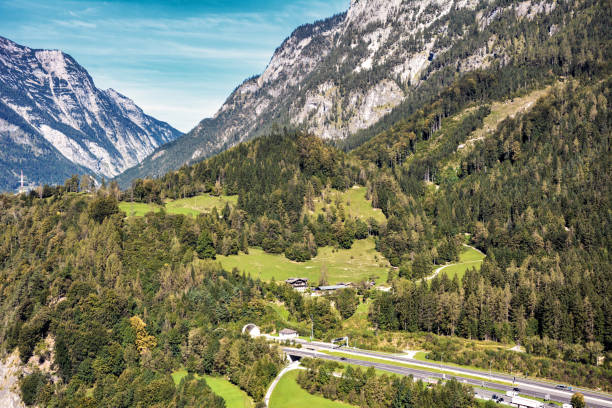 istock Highway which enters the mountains 1245017492