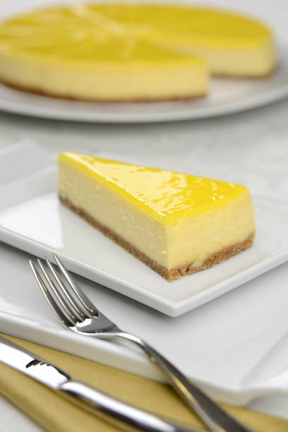 lemon cheesecake  in the dish on the table stock photo