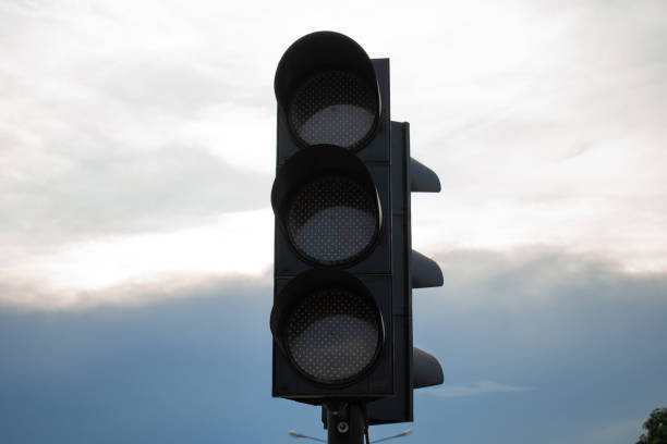 istock traffic light on the cloudy day bright sky 1245041542