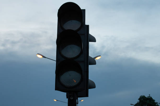 istock black traffic light on the sky with light and night 1245041683