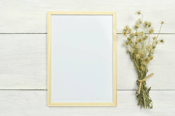 istock Blank whiteboard with dried flower on the side. 1245042038