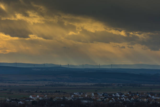 landscape and haeuser and windraeder with sun rays