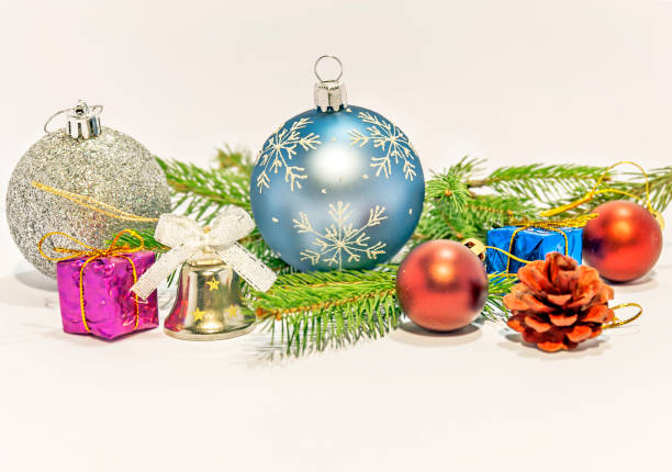 istock Several christmas decoration on green pine tree on white background 1245043169