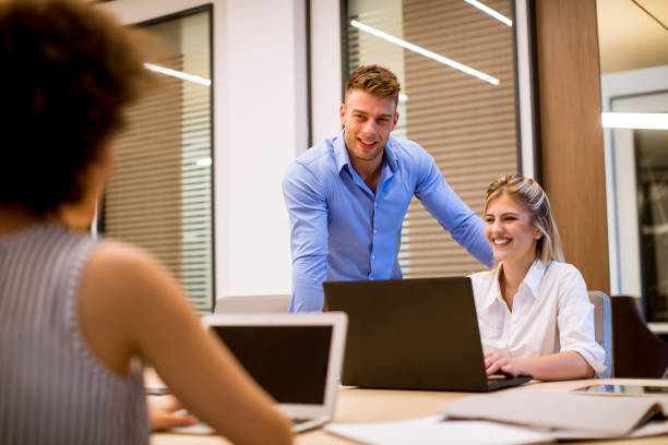 istock View at young business people working in a modern office 1245052210