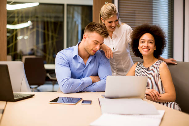istock View at young business people working in a modern office 1245052217