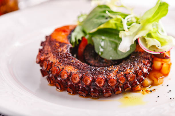 istock Close up of cooked octopus in a restaurant serving 1245056851