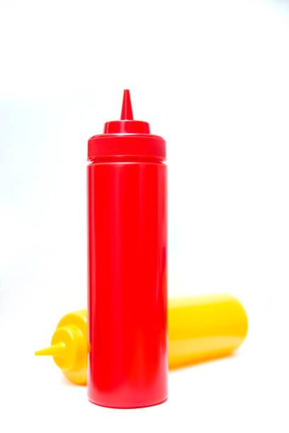istock Ketchup and mustard bottle isolated on white background 1245074770